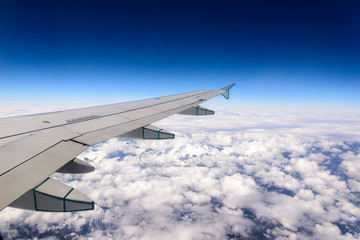 Plane Wing Over Clouds