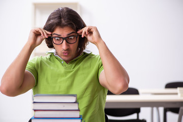 Young male student in the classroom