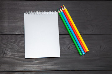 Fototapeta na wymiar notebook and pencils