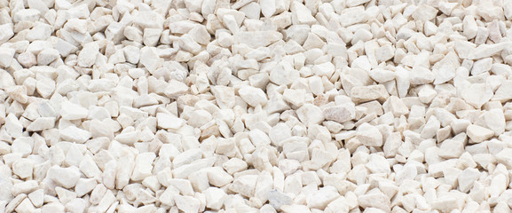 Small stones or rocks on sidewalk as background texture