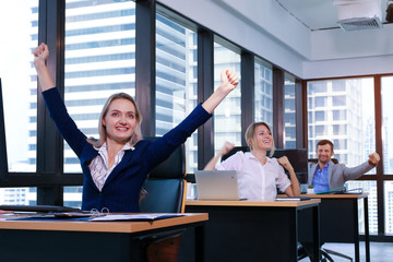 Professional Business people hand up or stretch the arms for relaxing in office