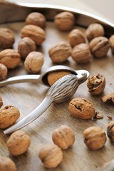 Nutcracker and Nuts.Walnuts  on wooden background. Tool for nuts. Delicious and healthy nuts.Keto diet ingredient