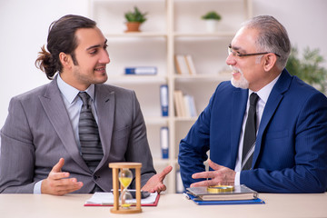 Two businessmen in time management concept