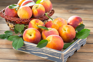 Ripe peaches on an old background