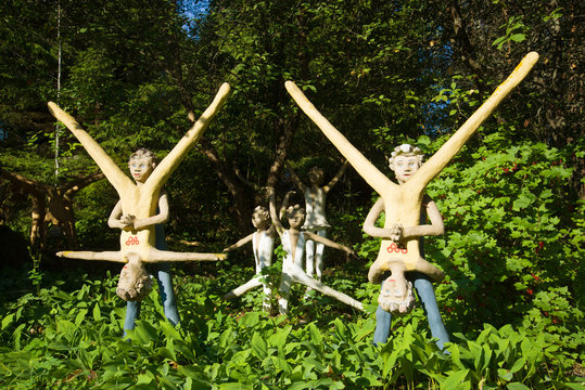 PARIKKALA, FINLAND - JULY 25, 2018: Sculptures of gymnasts by the Finnish sculptor Veio Ryonkkonen in his estate "The Mystical Forest"