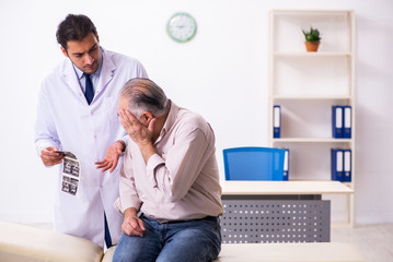 Old patient visiting young male doctor