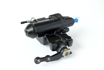 Close-up of the steering gear of the car on a white background. Spare parts for car repair and maintenance.