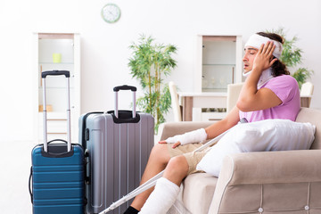 Young injured man preparing for the trip