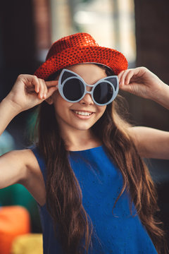 Pretty girl in eyeglasses posing for the photo