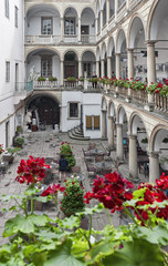 Italian courtyard in Lviv, Ukraine decorated with flowers