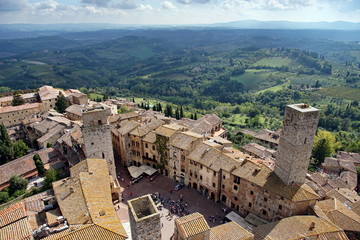Fototapeta na wymiar Via San Giovanni and the surrounding Tuscan countryside photographed from the Torre Grossa - San Gimignano, Tuscany, Italy