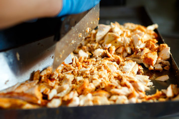 Close-up meat on special equipment, cook shawarma