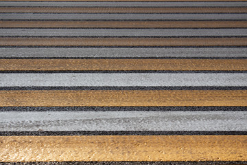 Yellow-white crosswalk. Road markings