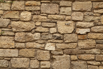 Gray stone wall made of natural stone