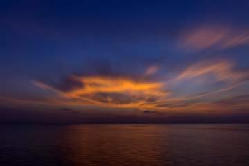 Naklejka na ściany i meble Motion color cloud on the twilight sky at the lake.
