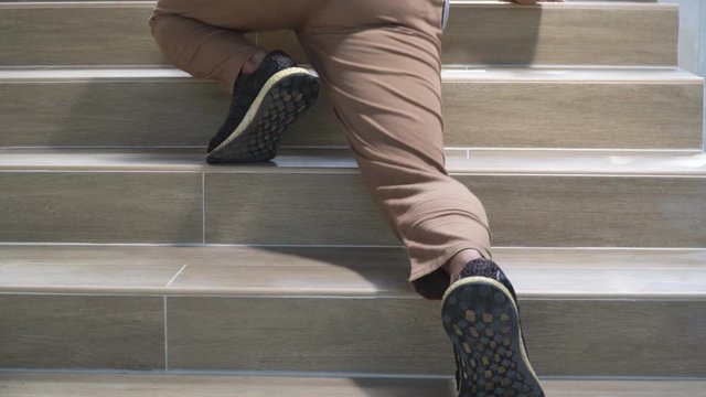 Adult man slip and falling down stair