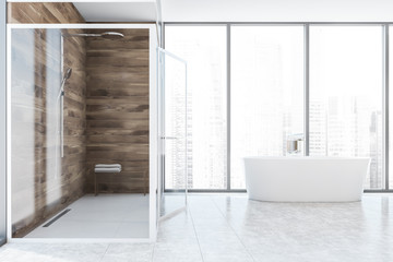 Bathtub and shower in wooden bathroom