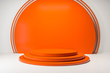 Round orange platforms in white and orange room