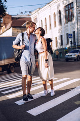 Couple want to kiss on crosswalk at sunset