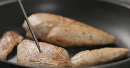 check temp of chicken fillet frying on non-stick pan