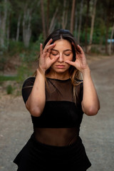 Young contemporary dancer and choreographer dancing outdoors Woman dancing in the environment.