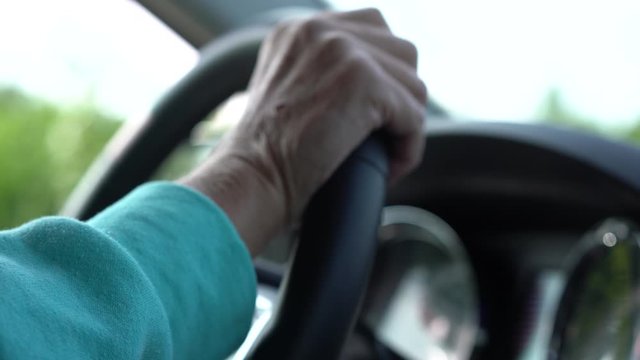 hands on steering wheel driving vehicle
