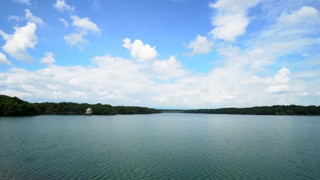 The main lake in Sayama Park in Tokyo, Japan, is one of the largest in that prefecture. On summer days it offers a beautiful view with an imposing sky where the horizon is clearly visible.