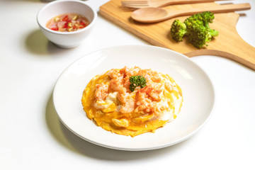 Creamy omelette with shrimps on rice served fish sauce with Thai chilis (Thai condiment “Prik Nam Pla”). Delicious and easy menu.  