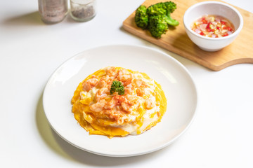 Creamy omelette with shrimps on rice served fish sauce with Thai chilis (Thai condiment “Prik Nam Pla”). Delicious and easy menu.  