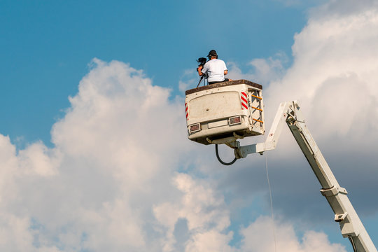 Cameraman Working On An Aerial Work Platform