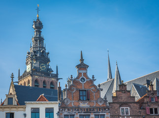 Tower of Sint-Stevenskerk (Saint Stephen's Church) and facade of historical houses in Nijmegen, The Netherlands