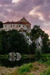 Picturesque Tyniec near Krakow, Poland. Benedictine Abbey, Monastery and Church on the Cliff . Clouds Reflection in Vistula River at Sunrise