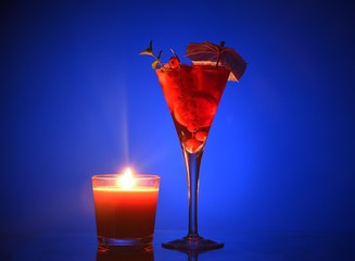 an evening cocktail. fruit evening cocktail, cocktail by candlelight