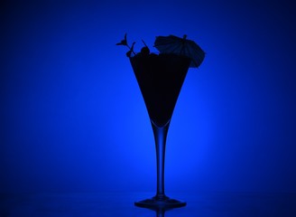 an evening cocktail. fruit evening cocktail, cocktail by candlelight