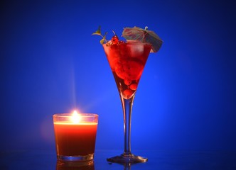 an evening cocktail. fruit evening cocktail, cocktail by candlelight