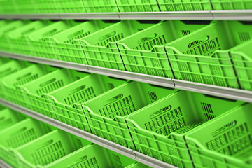 Plastic vegetable and fruit crates in a row on supermarket shelves.