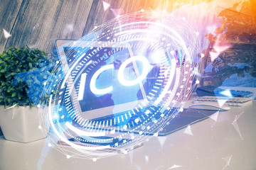 Multi exposure of blockchain theme hologram and table with computer background. Concept of bitcoin crypto currency.