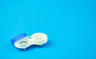 Contact lens on blue background