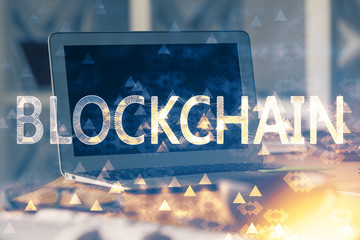 Multi exposure of blockchain theme hologram and table with computer background. Concept of bitcoin crypto currency.