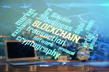 Multi exposure of blockchain theme hologram and table with computer background. Concept of bitcoin...