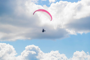 Paragliding in the sky on a sunny day.