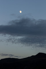 Fototapeta premium Moon next to the mountain in the Picos de Europa