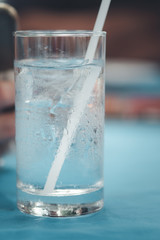 Water in a glass, selective focus