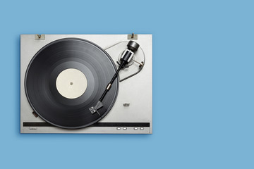 Vinyl player with long play or LP record on blue background.