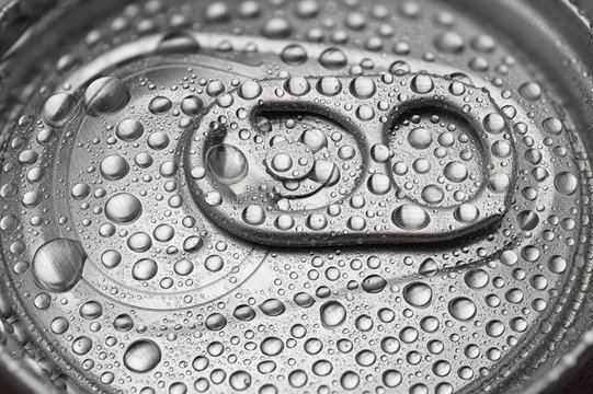 Cold aluminum can with water drops or dew close-up macro shot.