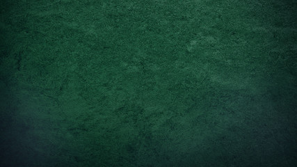 Grunge rough green stone background or texture. abstract green gradient with dark corners...