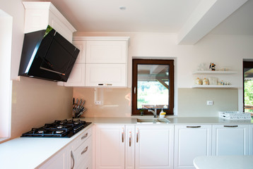 Naklejka na ściany i meble Interior of a rich house kitchen.