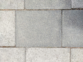 Obraz premium UK pavement grey paving stones in the street
