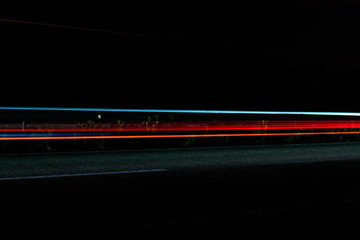 Fototapeta na wymiar Traffic light trails on a highway at night