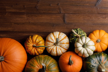 Pumpkins on wooden background